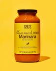 Jar of Sauz Summer Lemon Marinara sauce on a yellow background