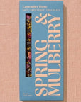 A rectangular chocolate bar packaged in sky blue paper with beige text reading "Lavender Rose"