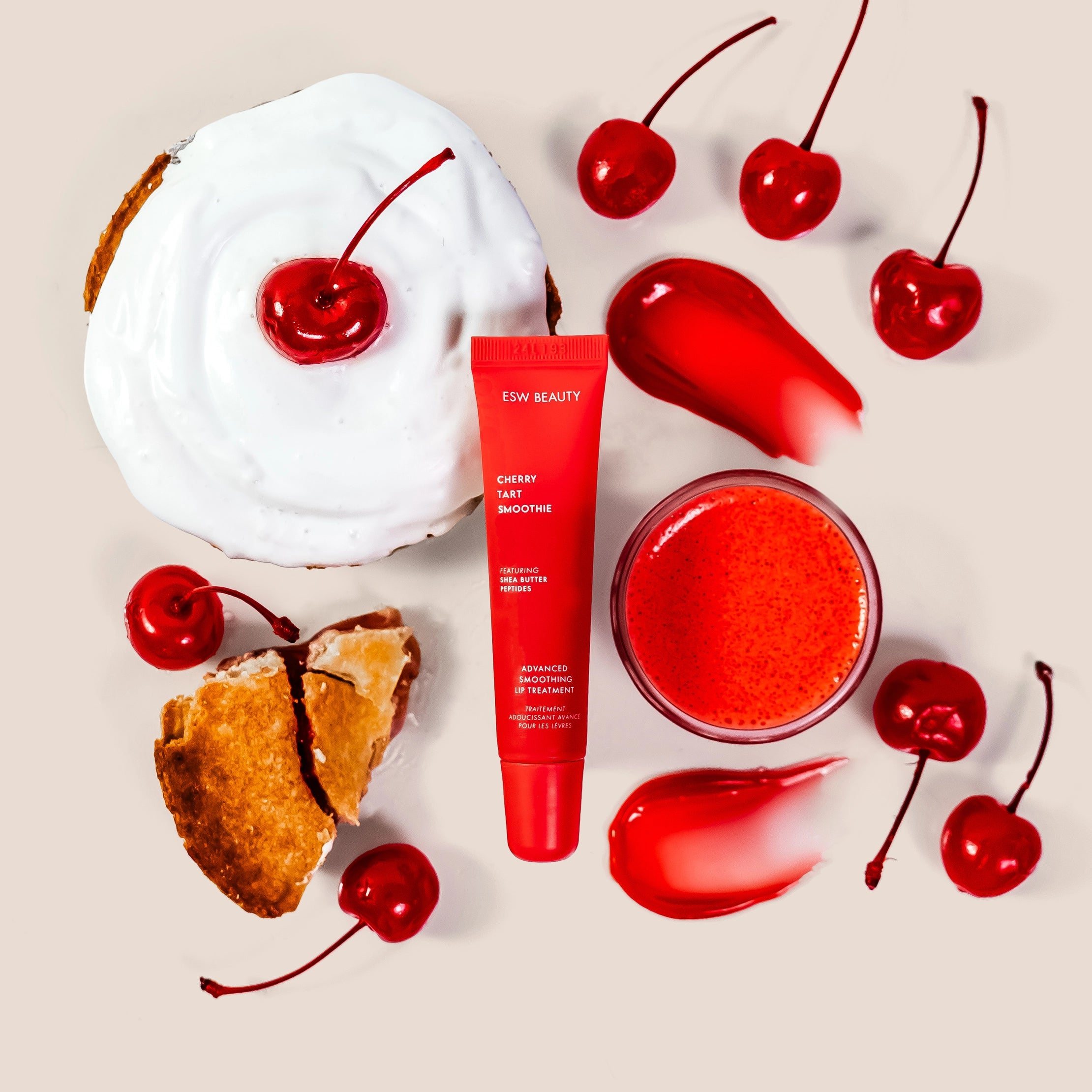 red lip balm surrounded by cherries & cherry pie