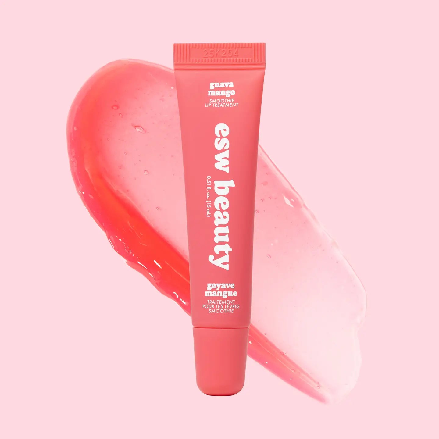 Pink lip balm tube with 'esw beauty' branding on a pink background