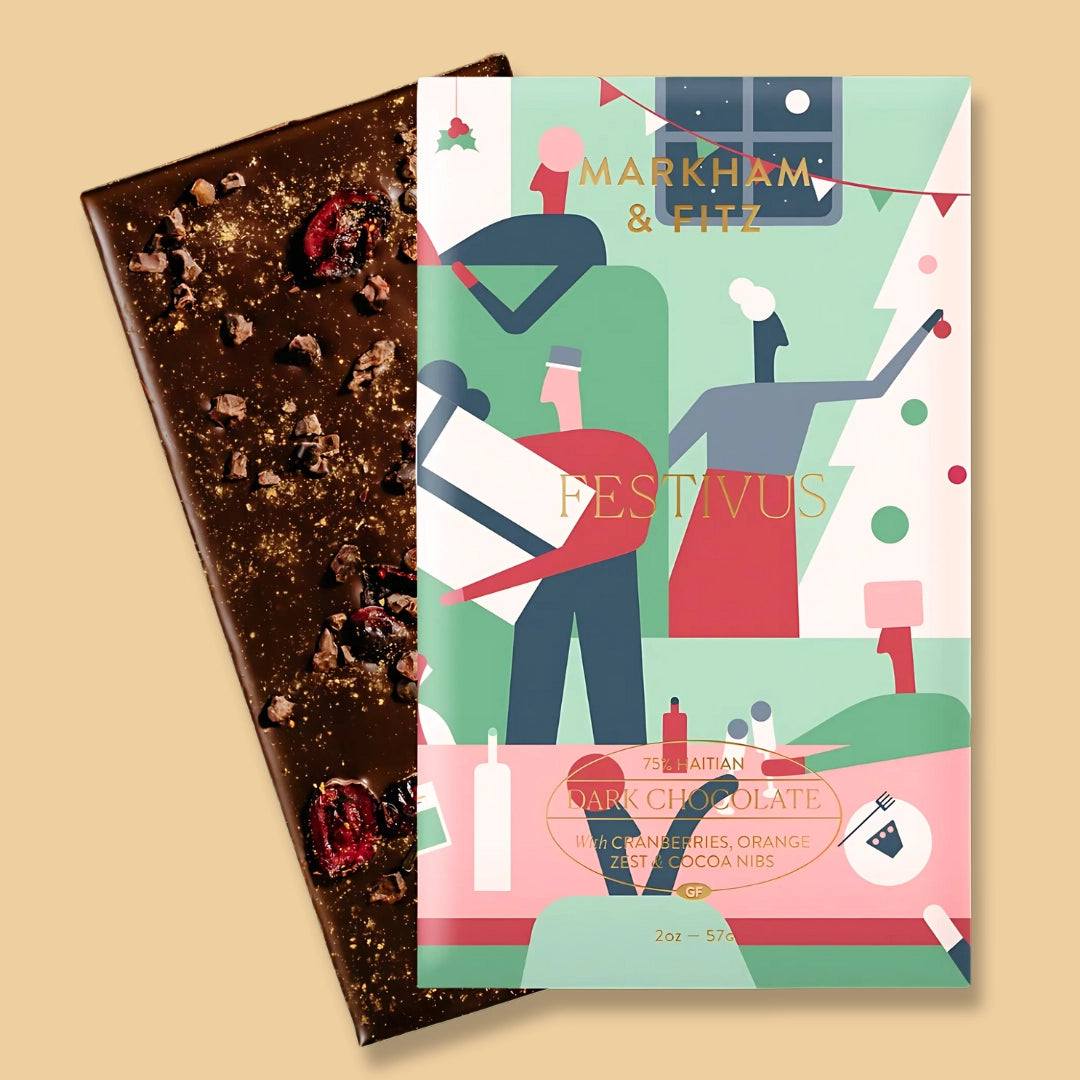 Dark chocolate bar with a festive-themed packaging on a beige background