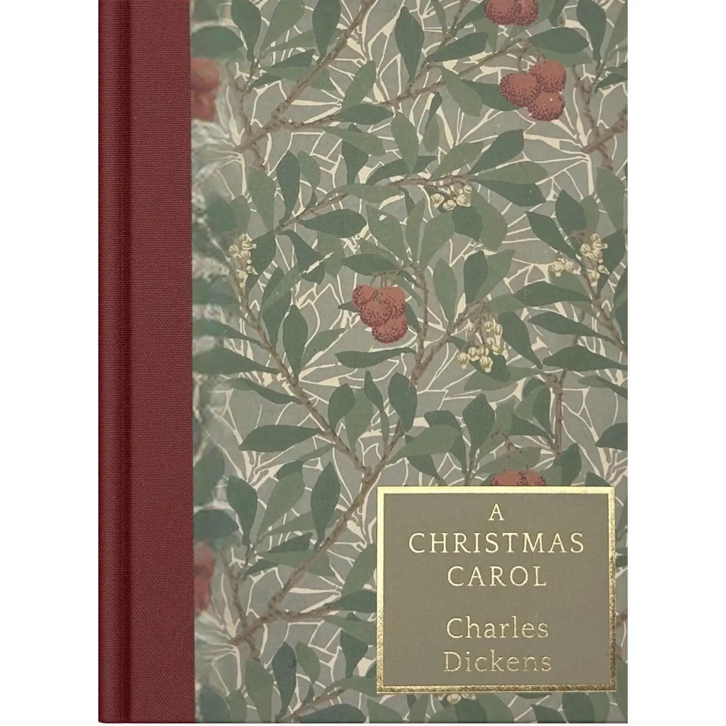 Book cover of 'A Christmas Carol' by Charles Dickens with a floral design and red binding.