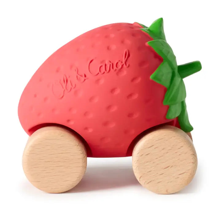 Strawberry-shaped toy with wooden wheels on a white background