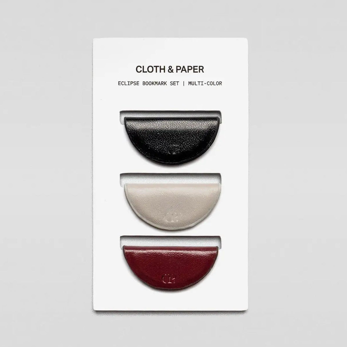 Set of three eclipse bookmarks on a white card with 'Cloth &amp; Paper' branding.