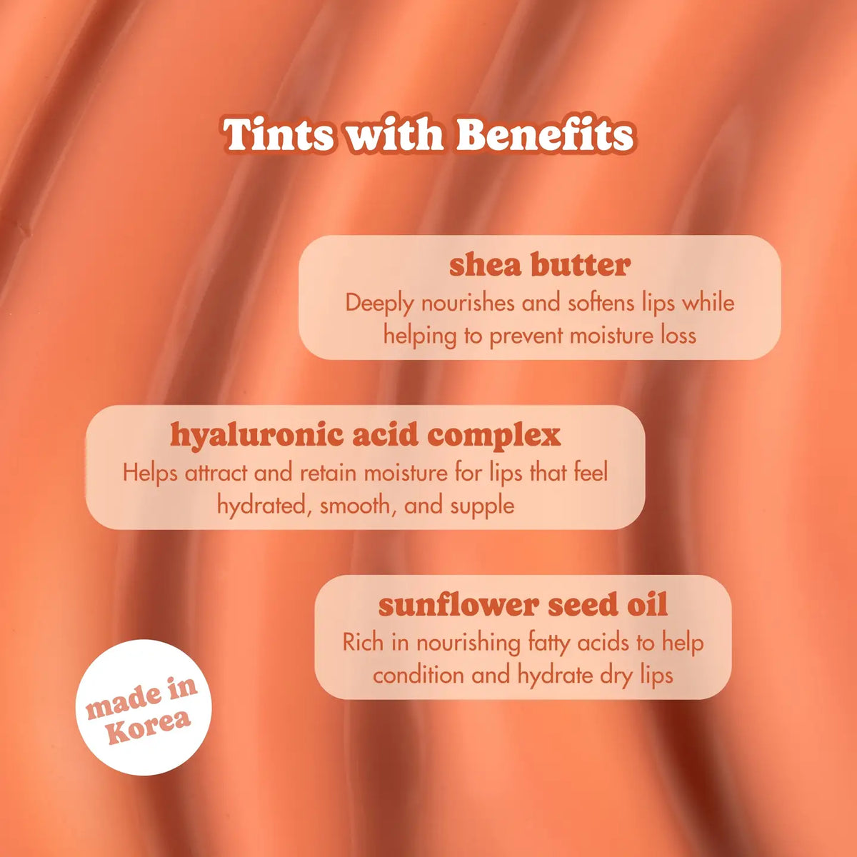 An informational graphic with the heading 'Tints with Benefits' over a peach-pink textured background. Three rounded text boxes list benefits: shea butter, hyaluronic acid complex, and sunflower seed oil.
