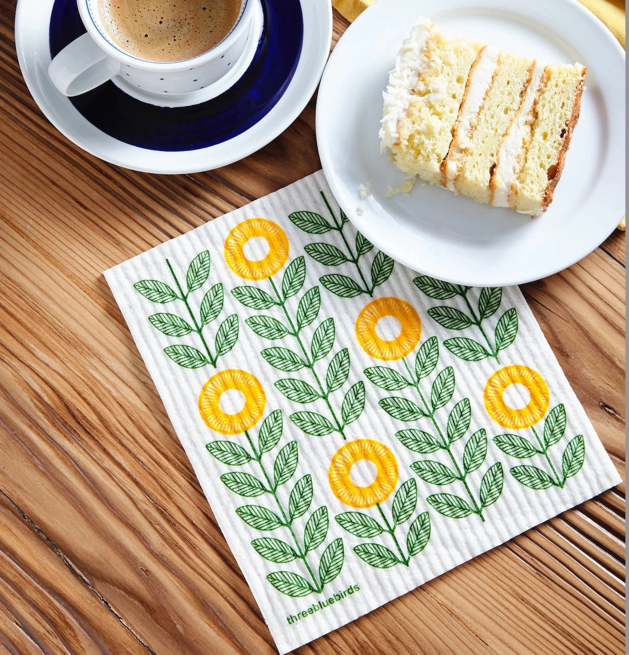 swedish dishcloth with sunflowers printed on it on a table 