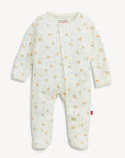 A baby footed sleeper in an off-white/cream color with a small orange and green floral pattern, shown flat on a light background.