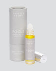 Thistle Farms Focus essential oil roll-on bottle and packaging on a light gray background