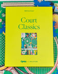 Green puzzle box labeled 'Court Classics' with a colorful illustration on a partially completed puzzle.