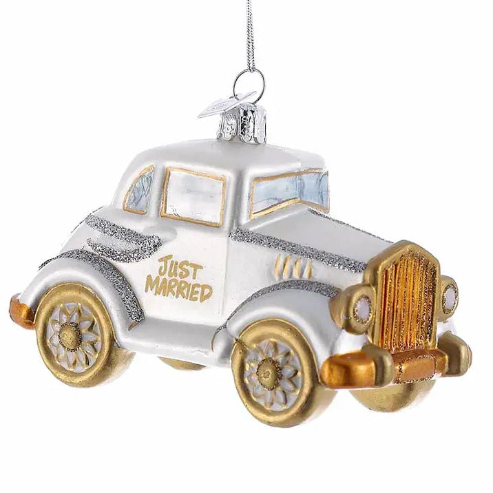 silver and gold wedding car ornament that says just married