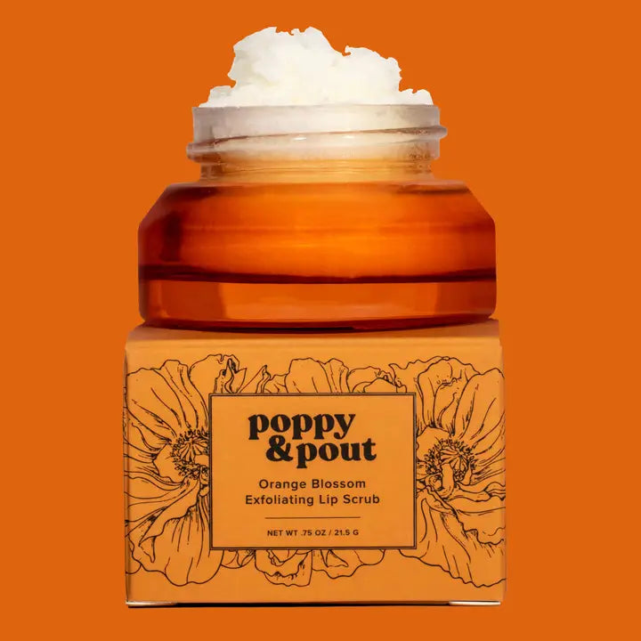 Orange lip scrub jar with floral design and 'Poppy & Pout' branding on an orange background