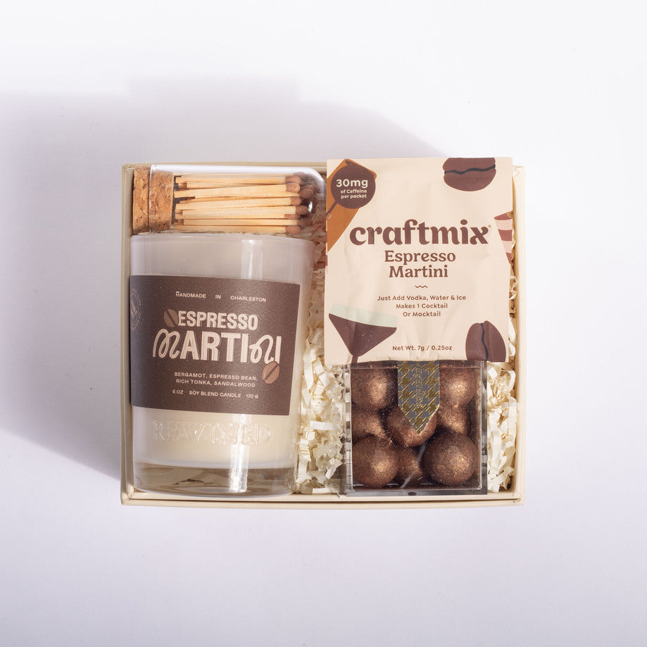 A gift set in a light wood box containing a candle labeled 'Espresso Martini' and a package of craftmix Espresso Martini chocolate truffles, arranged on a white background.