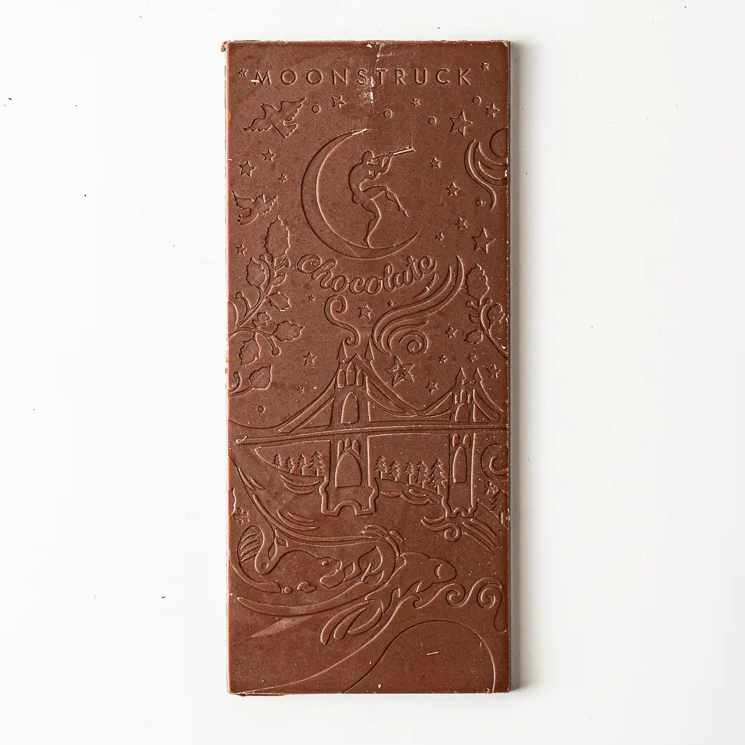 Chocolate bar with 'Moonstruck Chocolate' branding on a white background
