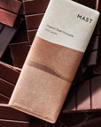 Mast Organic Dark Chocolate bar on a bed of chocolate pieces
