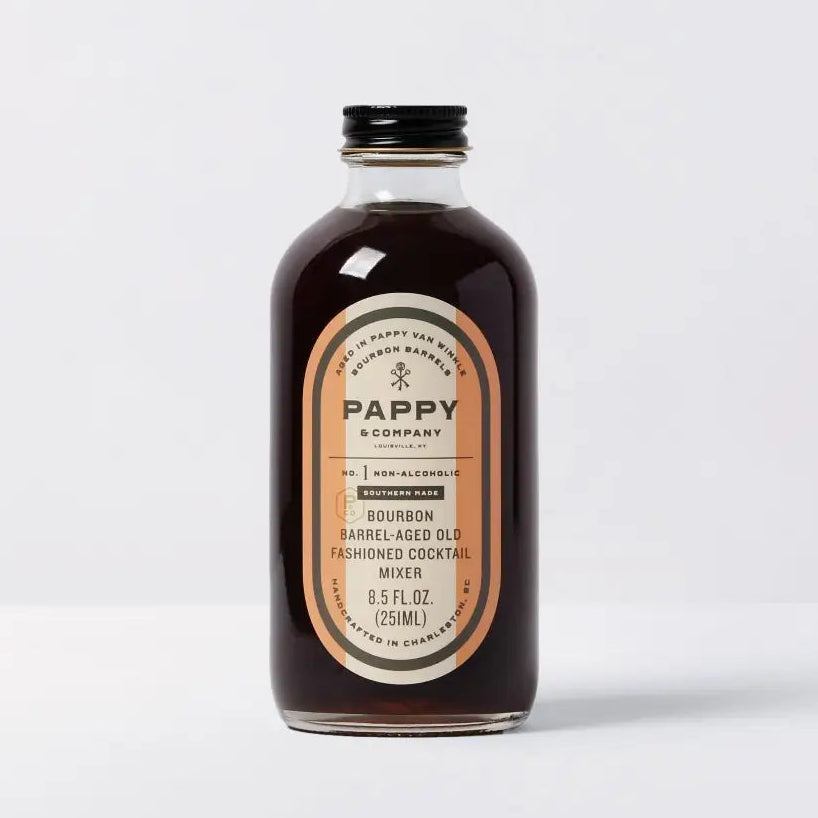 Bottle of Pappy & Co. non-alcoholic bourbon old fashioned cocktail mixer on a white background