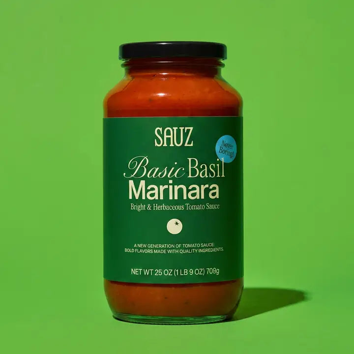 Jar of Sauz Basic Basil Marinara sauce on a green background