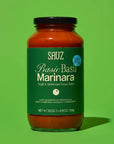 Jar of Sauz Basic Basil Marinara sauce on a green background