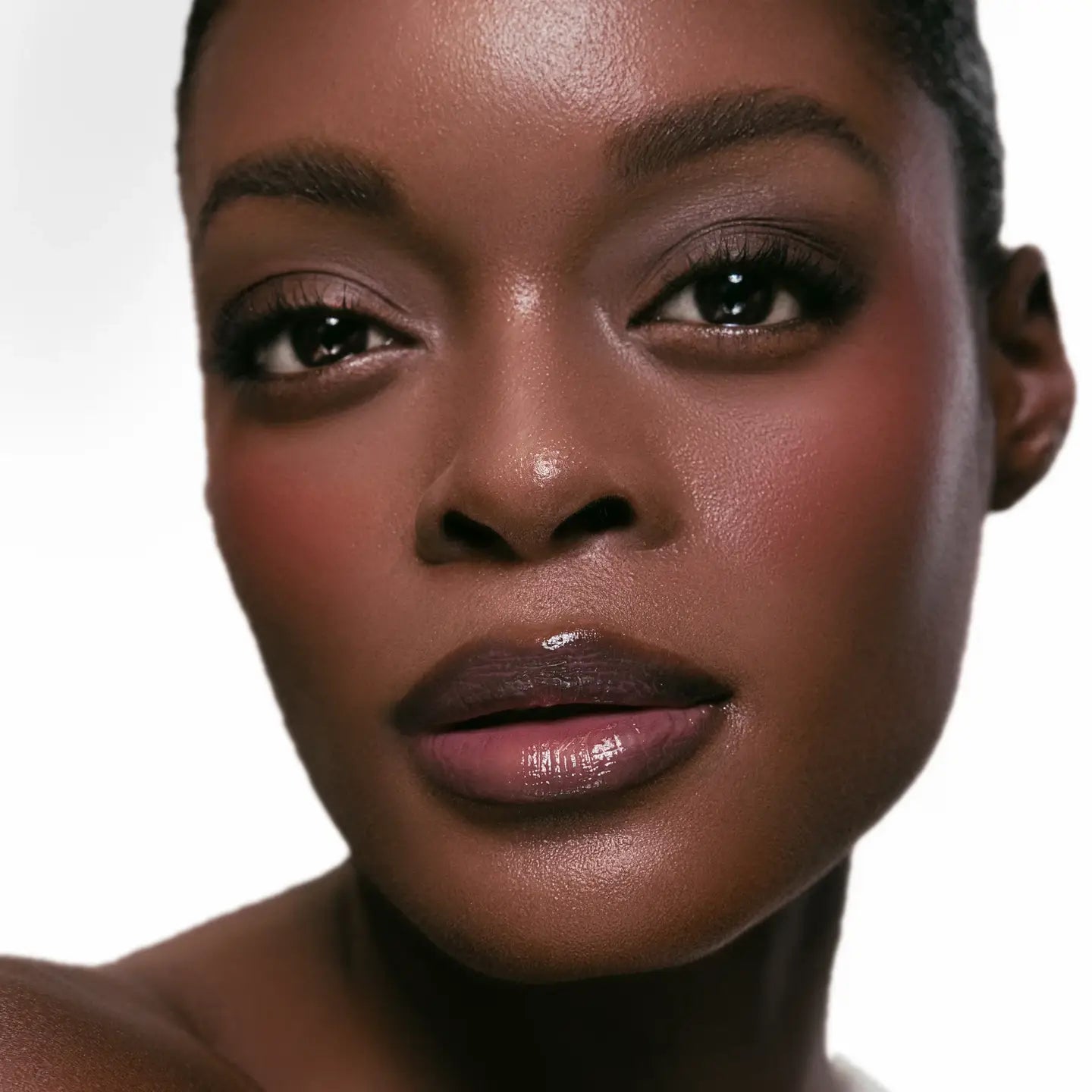 Close-up of a woman's face with a neutral background