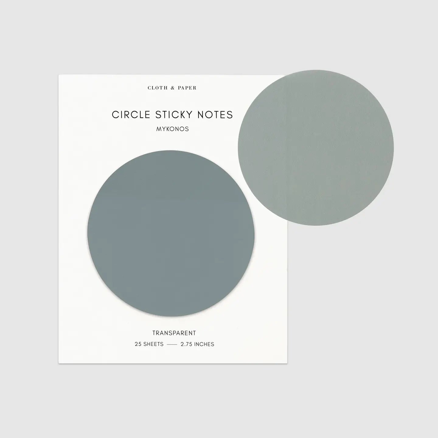 A package of Cloth &amp; Paper Circle Sticky Notes in the Mykonos colorway, featuring two circular sticky notes in a muted grayish blue-green shade on a white backing card, set against a light gray background.