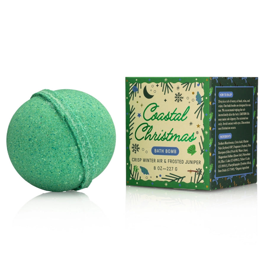 Green bath bomb with 'Coastal Christmas' packaging on a white background