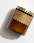 Candle jar with a brown label on a white background