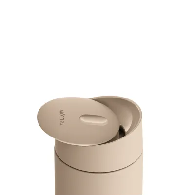 Beige container with a lid on a white background
