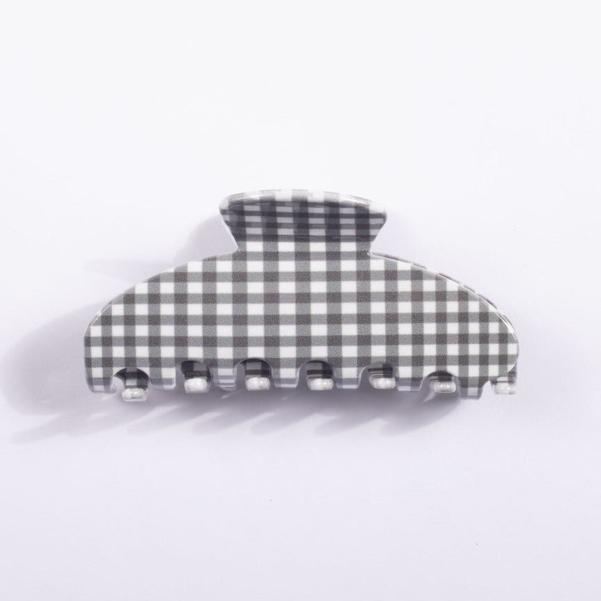 A single claw-style hair clip with a gray and white gingham checkered pattern, photographed on a clean white background.