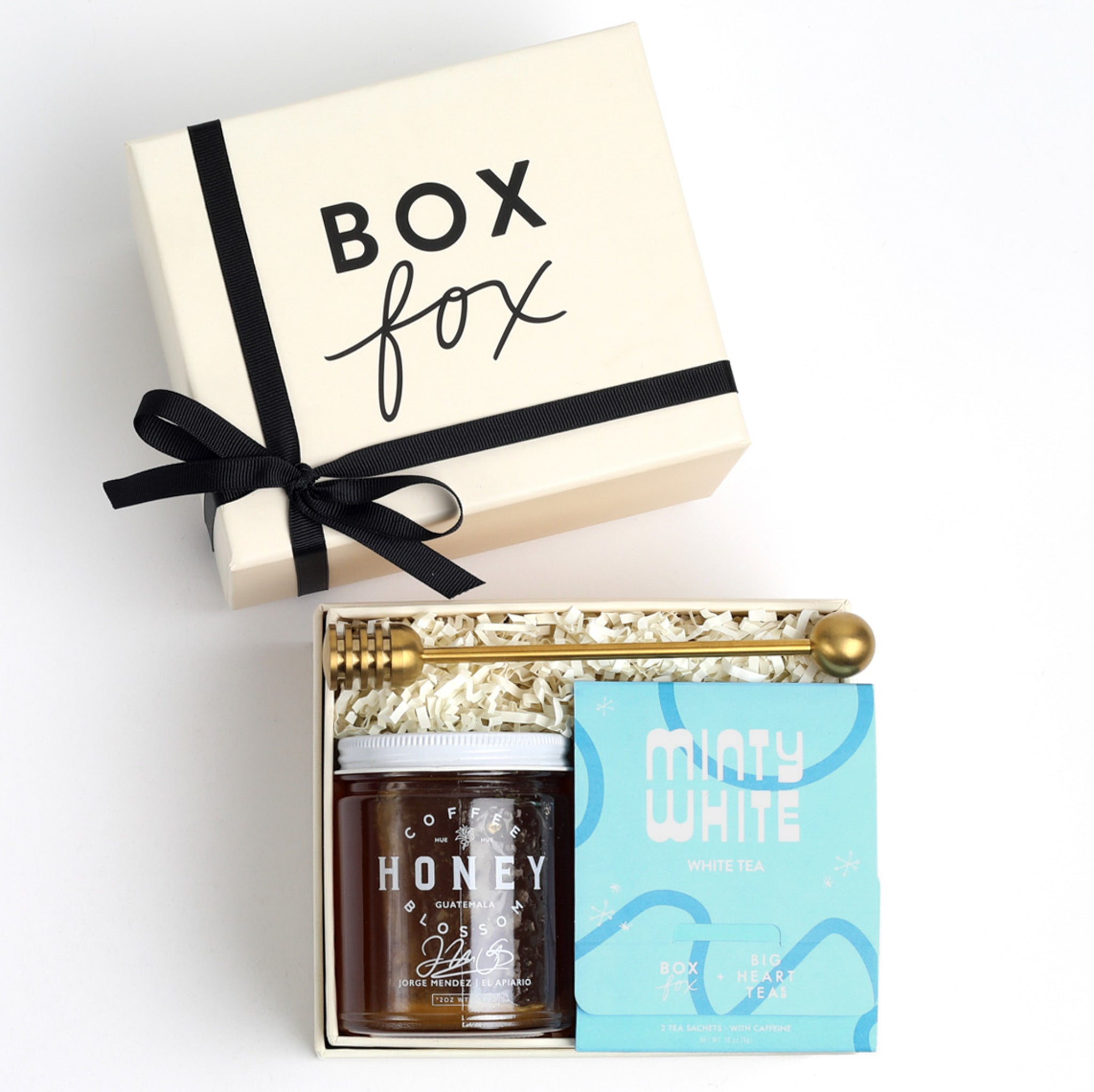 BOXFOX Creme gift box packed with gold honey dipper, jar of honey and blue minty why tea sachet