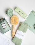 The GREEN GODDESS gift box in creme, including sage luxe socks, large candle, dry brush, collagen face mask, hand cream, scalp scrubber, silk scrunchie and hair towel.