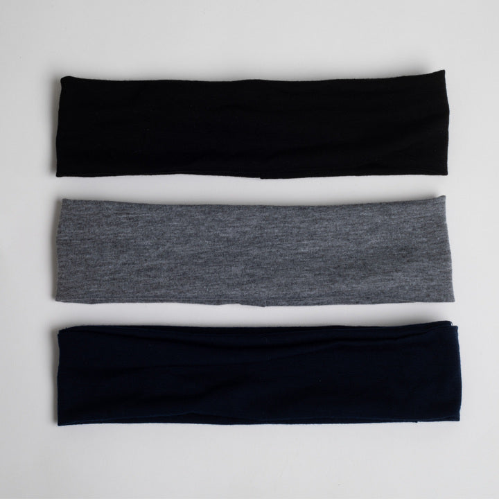 This set shows a black headband on top, a grey headband in the middle, and a dark navy headband at the bottom.