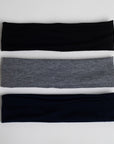 This set shows a black headband on top, a grey headband in the middle, and a dark navy headband at the bottom.