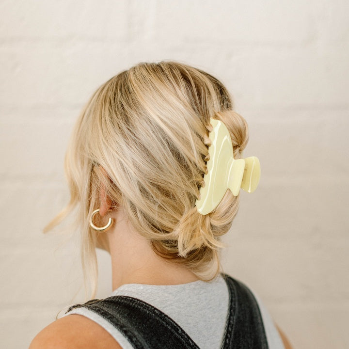 yellow clip in blonde hair