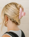 pink hair clip in blonde hair