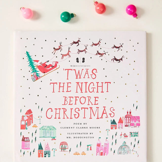 Book titled 'Twas the Night Before Christmas with colorful Christmas ornaments on a white background