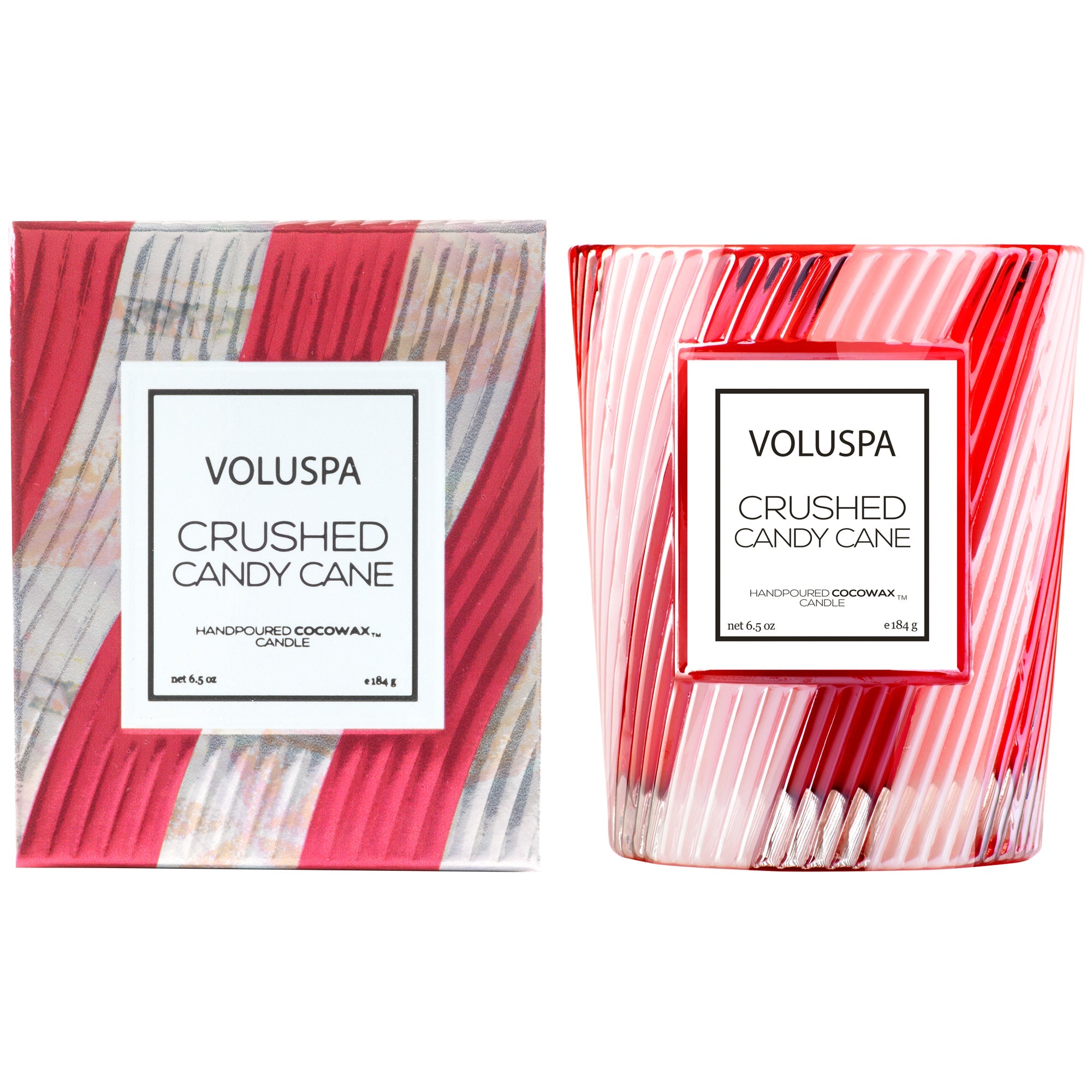 Crushed Candy cane candle package and candle outside of packaging to the right of the box. Both the box and candle glass are white and red stripped diagonally. Label for candle are in the middle of both. 