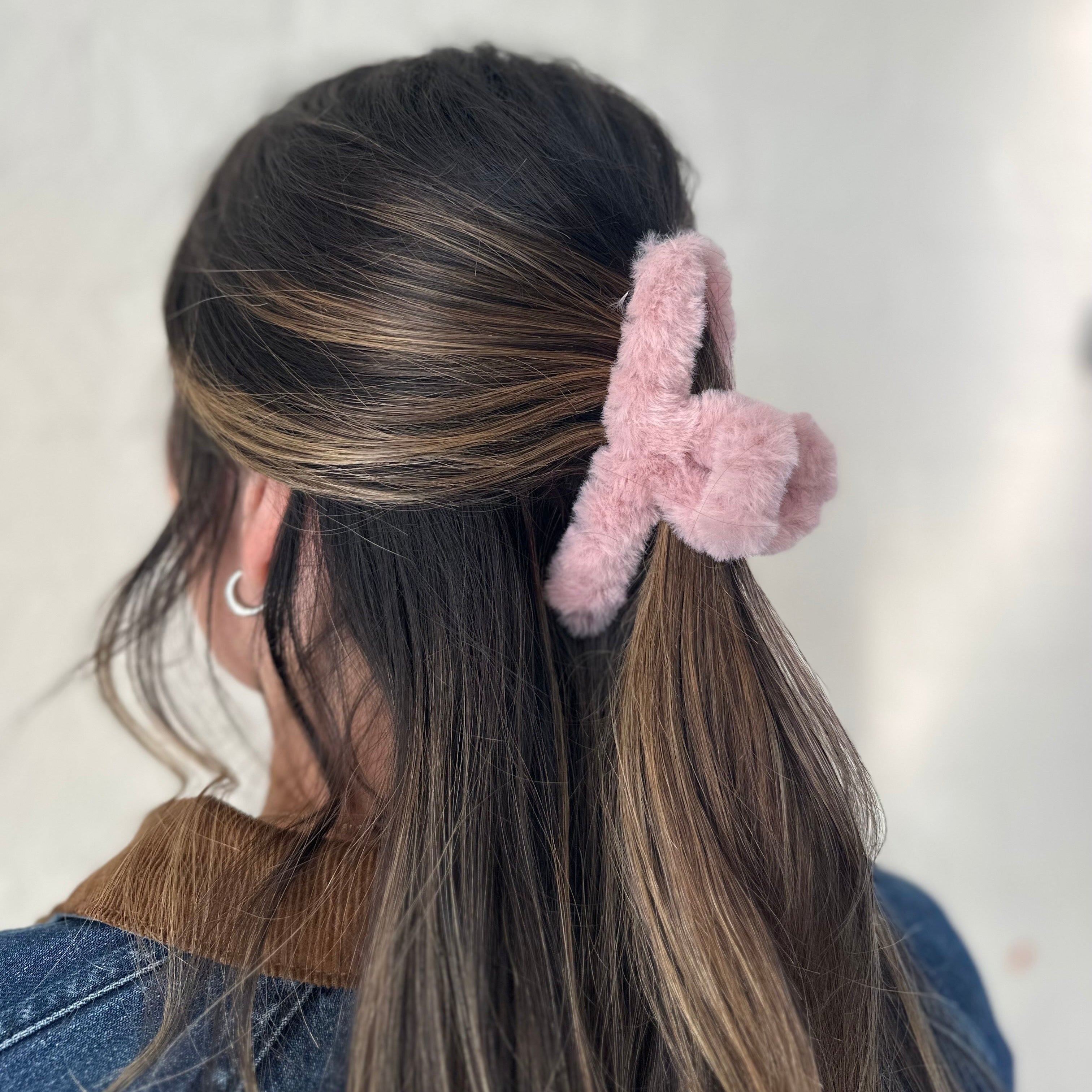 dusty rose fuzzy claw clip in brunette hair