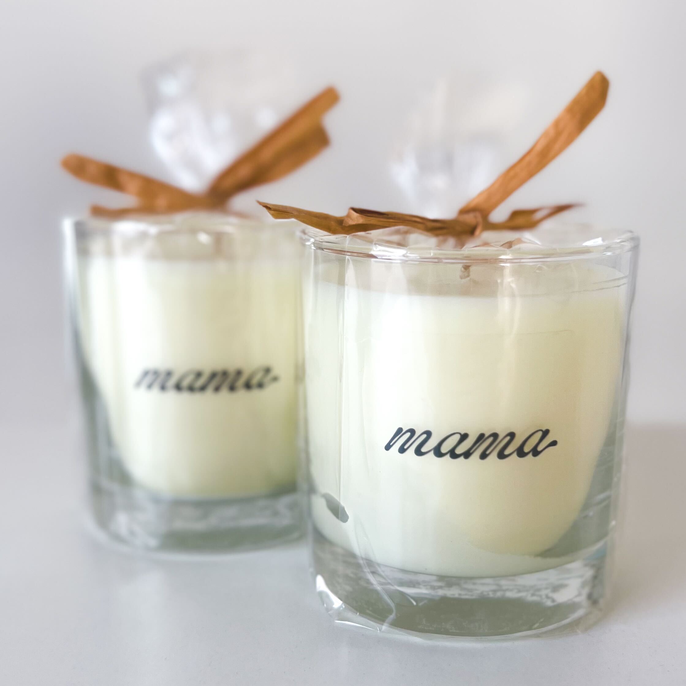 2 candles with 'mama' written on them