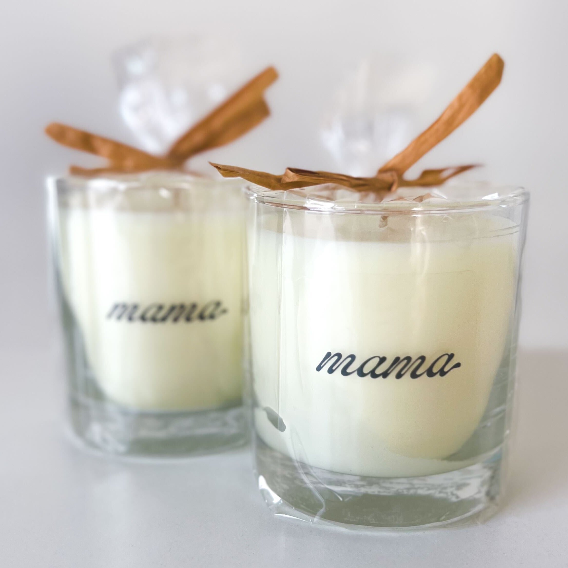 2 candles with 'mama' written on them
