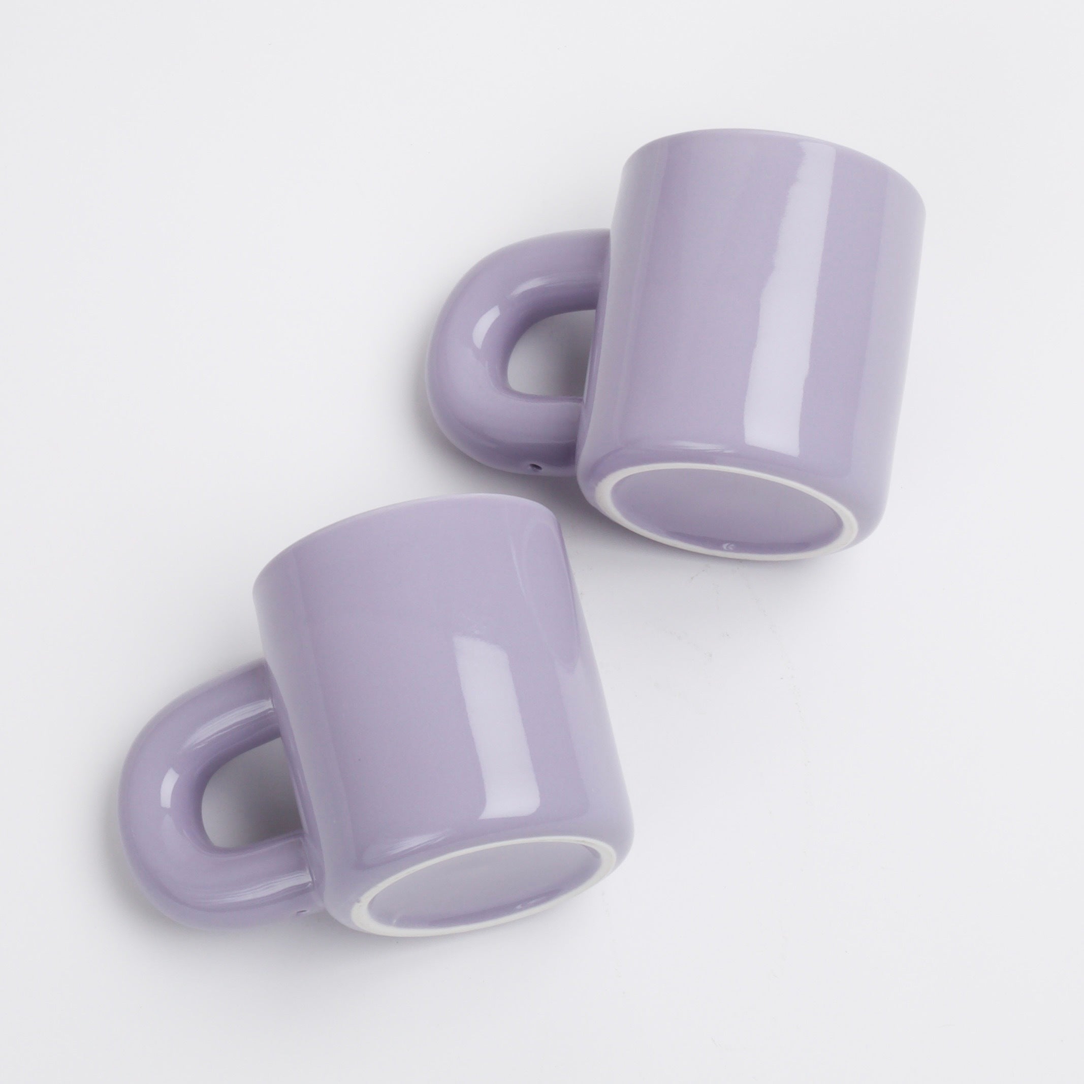 2 thick purple ceramic mugs