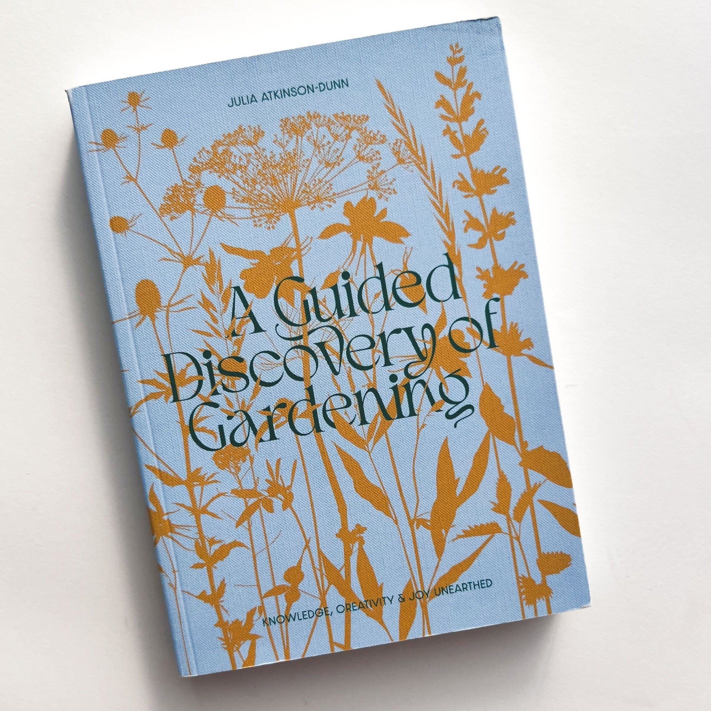 Blue book cover for A Guided Discovery of Gardening