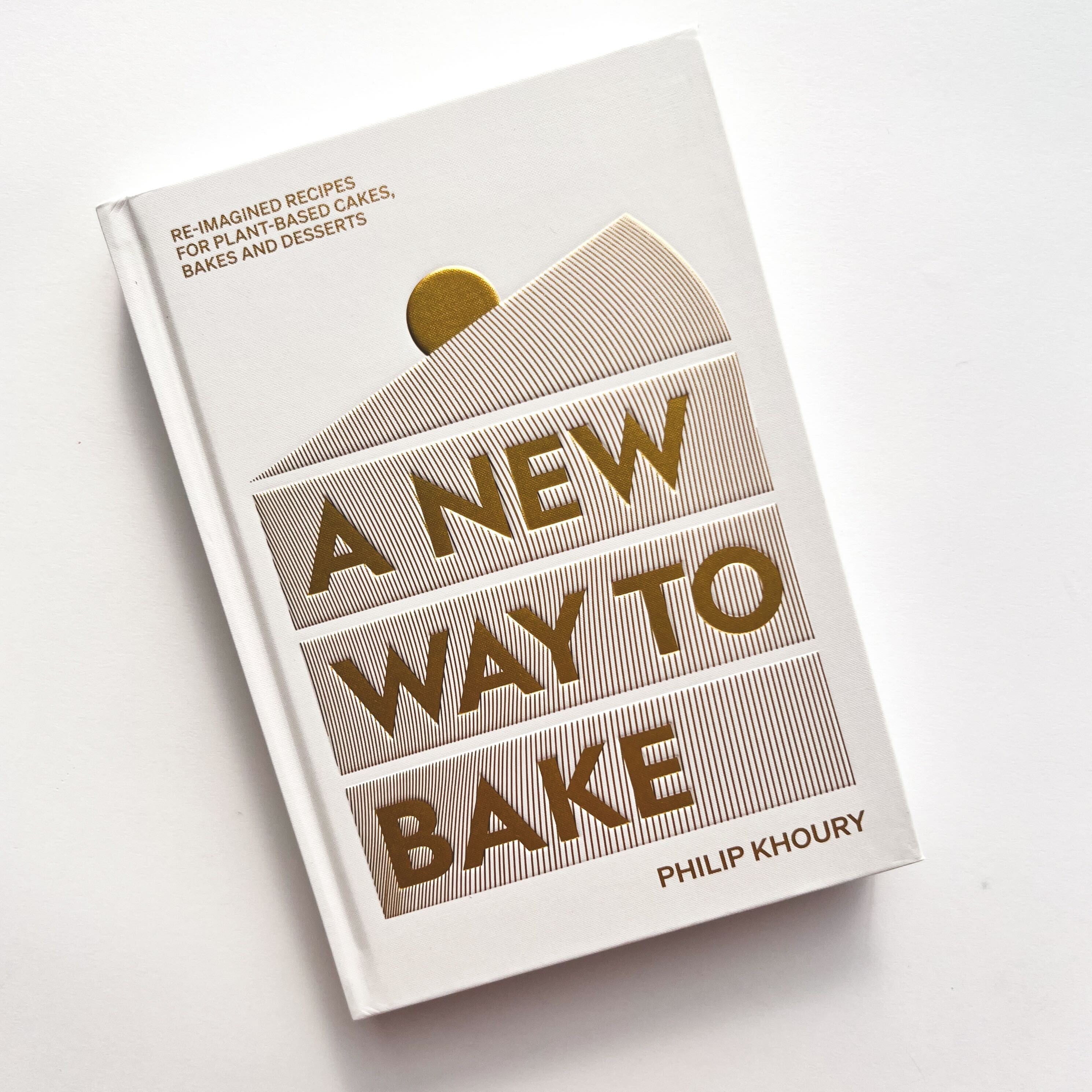 A NEW WAY TO BAKE book cover with gold cake