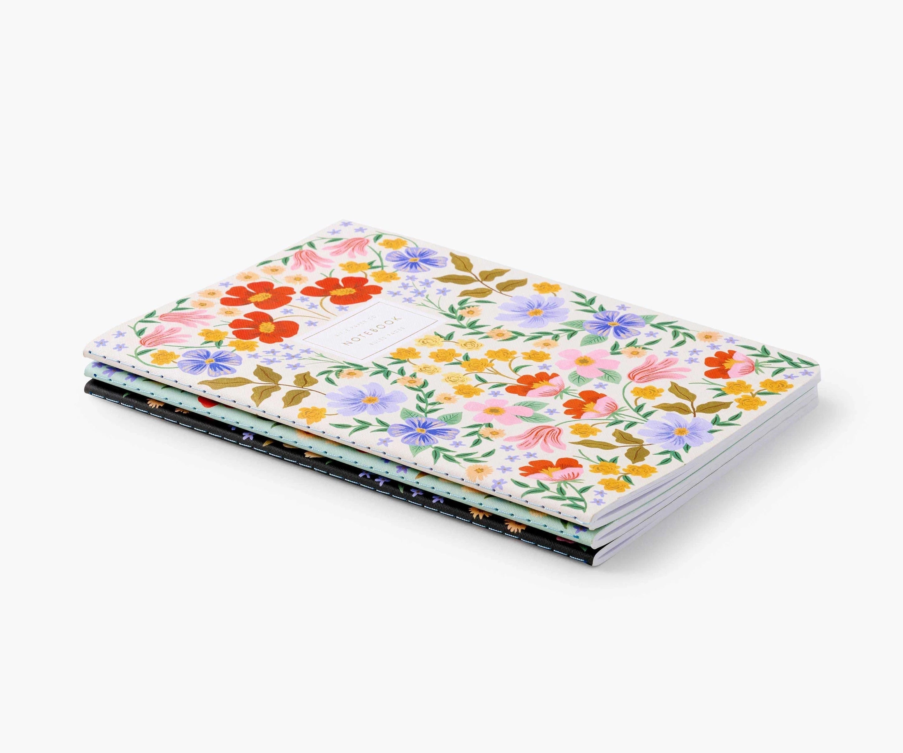 3 floral notebooks lying flat
