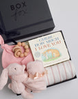 BOXFOX New Baby Girl Box including a swaddle, bunny soother, teether, hat, and book.
