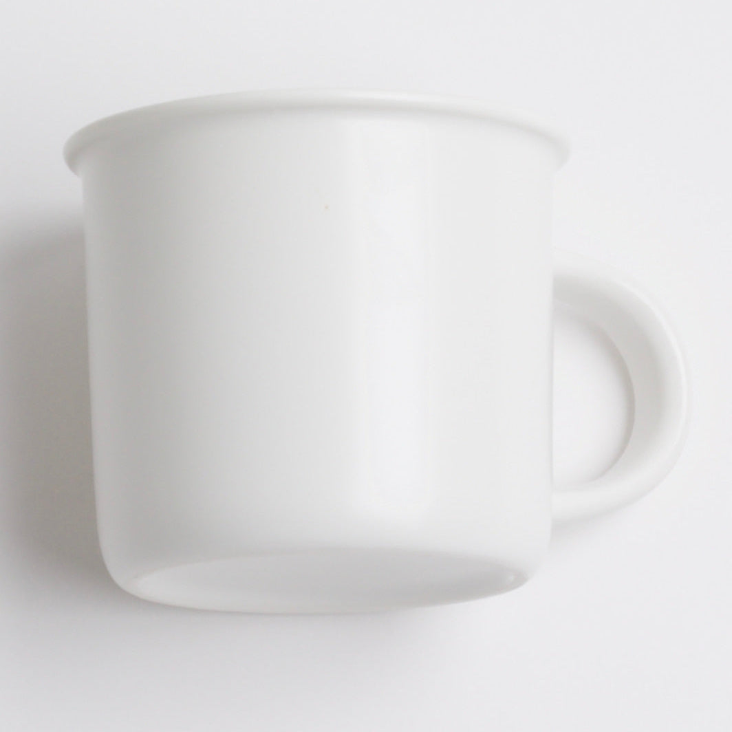 White ceramic pitcher on a light gray background
