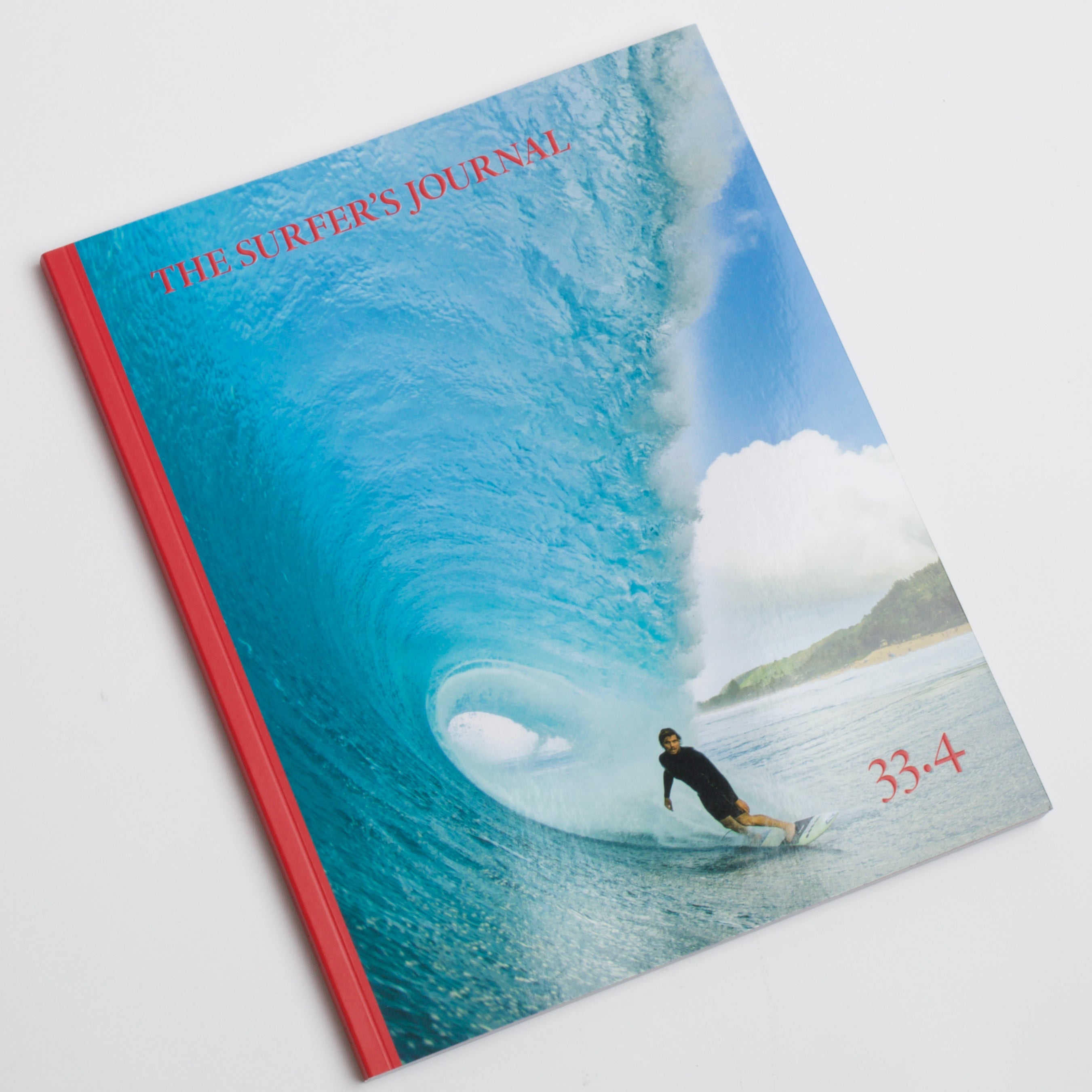 cover of The Surfer&#39;s Journal 33.4 featuring a man surfing inside a wave