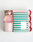 BOXFOX Creme gift box packed with voluspa sparkling rose candle, pink scallop trinket tray, pink mug, green and pink stripe notem and pink two tone scallop tea towel