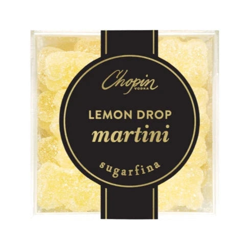 A close-up view of a clear box showcasing yellow bear-shaped gummy candies. The black and gold label on the front prominently reads "Chopin Lemon Drop Martini - Sugarfina."