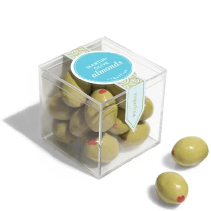 Clear plastic cube with martini olive almonds inside