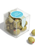 Clear plastic cube with martini olive almonds inside