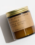 An orange candle with a gold lid with the description of, " NO. 01: SPICED PUMPKIN SOY CANDLE," poured in California with Soy Wax, on a white background